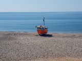 A Lone Fishing Boat On Branscombe Beach